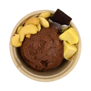 Scoop of chocolate ice cream in bowl with ingredients.